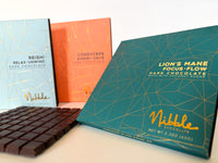 Nibble functional dark chocolate bars with Reishi, Cordyceps and Lion’s Mane, handmade in San Diego, California.