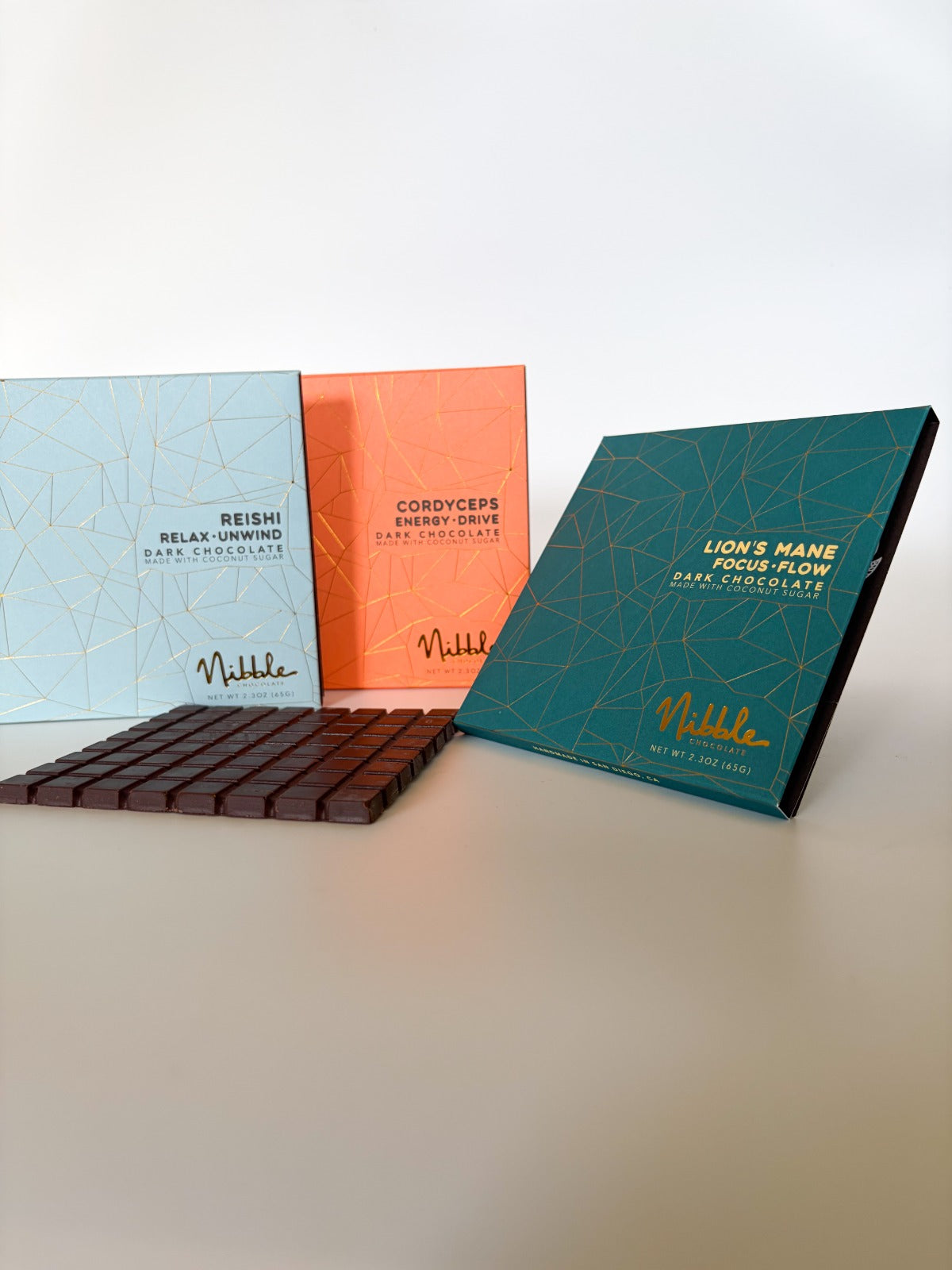 Nibble Lion’s Mane Focus Flow dark chocolate bar with coconut sugar and handmade chocolate pieces.